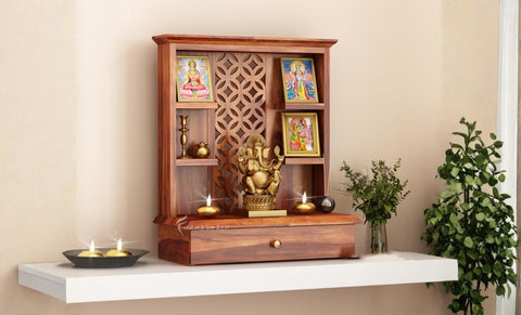 Sanvi pooja cabinet shown on a white shelf with idols.