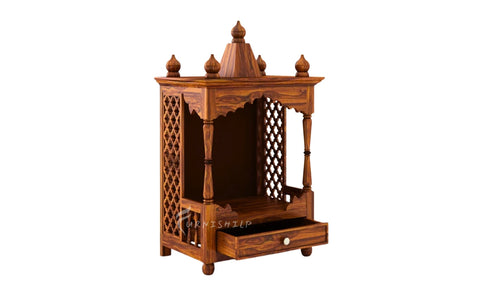 Wooden prayer altar with intricate designs on a white background
