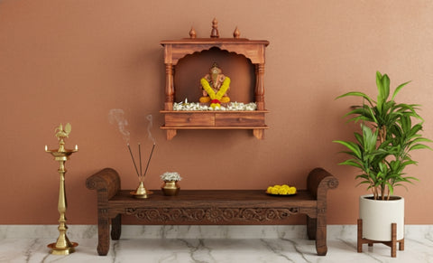 Small wooden mandir with two drawers, shown on a wall.